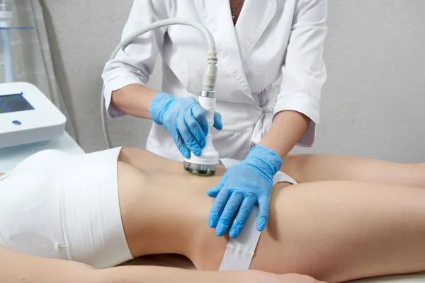 woman having HIFU treatment on her stomach to combat loose skin Welford on Avon following weight loss